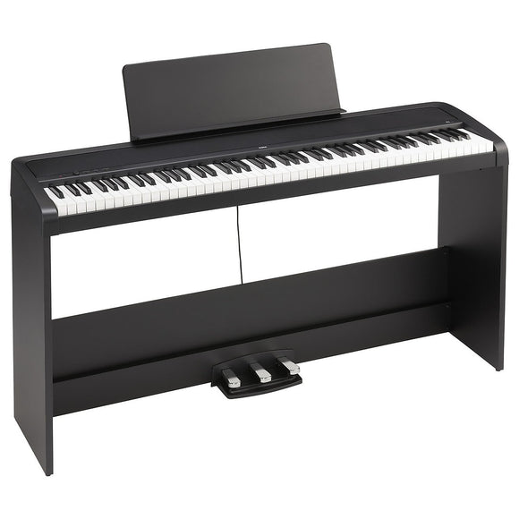 The Korg B2SP-BK Digital Piano w/ Stand & Bench features a New piano sound engine with 12 carefully selected sounds, Convenience and functionality with the simplicity of a real piano, and a Lightweight body, less than 10 kg including speakers.